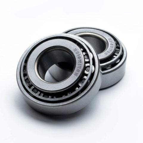 Front Wheel Bearing Rebuild Kit With Upgraded 304 Stainless Steel Axles And Spring Loaded Seals For Scag Exmark Toro Mowers close-up of two bearings