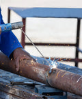 E308L-16 Welding Rod 1 16th Inch By 10 Inch For Stainless Steel Welding in action on rusted steel pipe