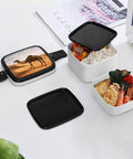Desert Sand Camel Double Layer Bento Box With Spoon Portable Insulated Lunch Container shown open with food and lid nearby.