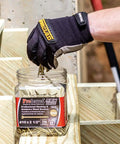Gloved hand using MAX Drive Exterior Decking And Outdoor Wood Screws With Bronze SKT Coating For Exterior Wood 2.5 Inch #10