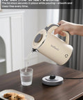 Person pouring water from On The Go Grab And Go Portable Electric Kettle 24oz Mini Travel Kettle For Camping And Office 600W