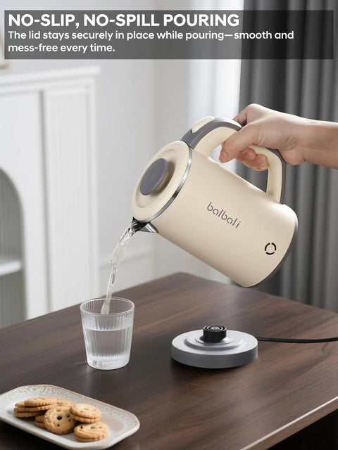 Person pouring water from On The Go Grab And Go Portable Electric Kettle 24oz Mini Travel Kettle For Camping And Office 600W