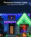 Halloween-themed house with 32.8 Foot RGB LED Strip Lights With Music Sync For Bedroom Living Room And Parties Easy Install Bluetooth App Control And 44 Key IR Remote Color Changing Ambient Lighting That Sets The Mood And Keeps The Vibe Lit, displayed in vibrant colors and shapes.
