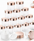 Score 16 Fresh 2 Oz Frosted Glass Sample Jars With Sleek Rose Gold Screw Caps And Tight Inner Liners arranged neatly.