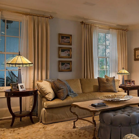 Living room with stained glass Tiffany style table lamp, 16 inch cream shade, next to beige sofa, cozy home office vibe