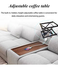 Adjustable coffee table with a hidden height adjustment feature, compact design, and charging capability on a sofa.