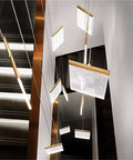 Modern Staircase Chandeliers Led Pendant Light for High Ceiling,Residence with gold accents and multiple hanging panels.