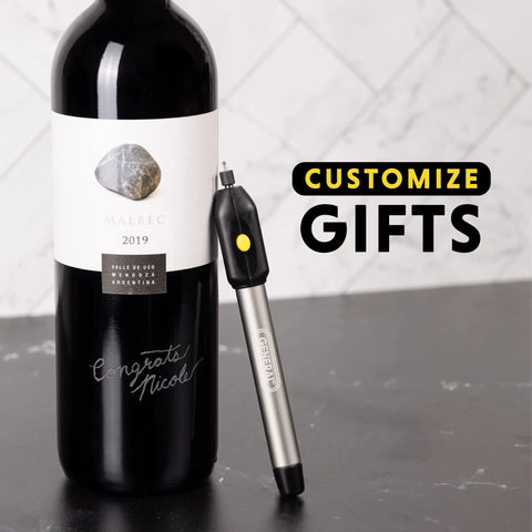 Cordless Engraving Pen For Metal With Diamond Tip Etching Tool Dope For Toys, Sporting Goods, Glass Gifts And More Fast, Easy Personalization For DIYers And Pros next to engraved wine bottle