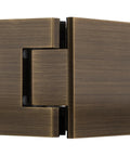Close-up of Geneva 045 Series Antique Brass Glass to Glass Hinge for Frameless Doors, 135 Degree Self Centering