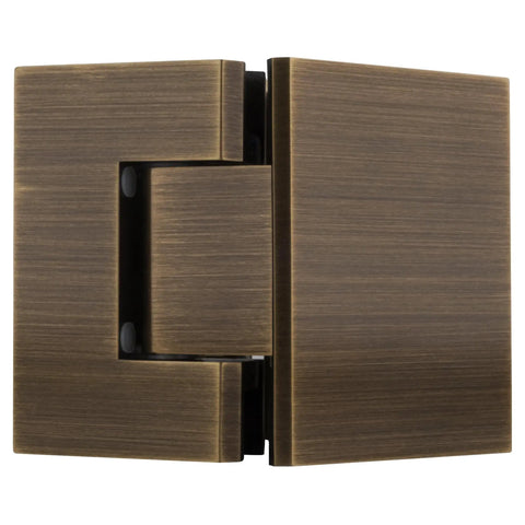 Close-up of Geneva 045 Series Antique Brass Glass to Glass Hinge for Frameless Doors, 135 Degree Self Centering