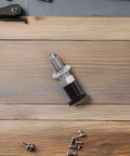 M10 Stainless Steel Reset Indexing Plunger Rock Solid Spring Locking Pin on wooden surface, showing detailed design for heavy duty use.