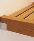 Close-up of Honey Maple top of Top Tier Solid Wood Closet Organizer with soft close drawer and vented shelves.