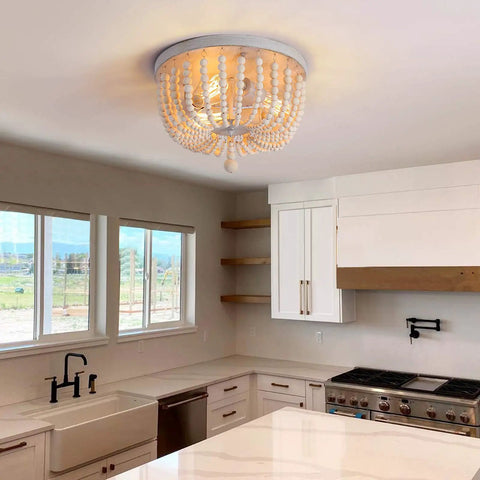 Wood Beaded Chandelier 3 Light Semi Flush Mount Boho Farmhouse Ceiling Light In Oak White Finish in a stylish kitchen.