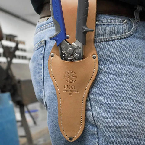 Person carrying Heavy Duty HVAC Cutter Tool With Built In Wire Cutter All Steel Double Edge Blades in leather holster on belt