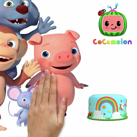 Hand applying Cocomelon Giant Peel And Stick Wall Decals with Alphabet, 134 Piece Set on smooth surface featuring cartoon characters