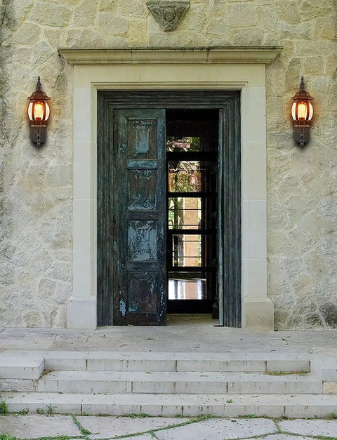 Two Pack Outdoor Wall Lanterns Waterproof Exterior Sconce Lights In Matte Black For Porch And Garage Doors With Vintage Retro Vibe Built Tough Weatherproof Metal Clear Glass Shade on stone wall