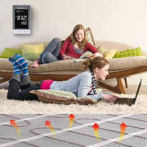 Programmable Thermostat For Electric Floor Heating With Alarm And Built In GFCI, visible with its large backlit LCD display in living room
