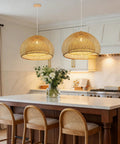 Natural Bamboo Pendant Light With Handwoven Wicker Lampshade And Wood Canopy Eco Friendly Ceiling Fixture For Bedroom Living Room Or Dining Area 17.7 By 11.8 Inches Vintage Vibe Soft Warm Glow in a kitchen setting.