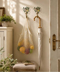 Vintage Flower Wall Hooks, Distressed Metal Coat Rack Set, Ace Farmhouse Entryway Organizer with a woven bag and umbrella.
