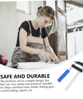 Person using 4 Pack Woodworking Clamps Quick Grip Clips Set For Fast Holding And Fixing at a workbench, durable wood tools visible