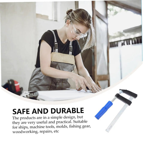 Person using 4 Pack Woodworking Clamps Quick Grip Clips Set For Fast Holding And Fixing at a workbench, durable wood tools visible