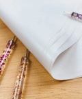 Close-up of 100 Sheets White Carbon Transfer Paper 11.7 By 8.3 Inches With Pattern Tracing Stylus for wood burning and carving.