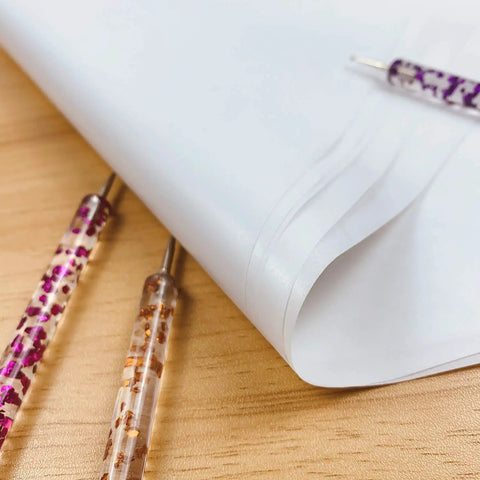 Close-up of 100 Sheets White Carbon Transfer Paper 11.7 By 8.3 Inches With Pattern Tracing Stylus for wood burning and carving.