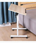 Heavy Duty Rolling Laptop Desk With Secure Locking Brake Casters Adjustable Mobile Workstation Table For Bed Sofa Living Room Home Office Gaming Lounge Setup in a tilted position.