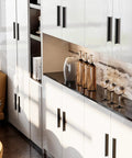 10 Pack Matte Black Cabinet Handles For Kitchen And Bathroom Renovations With 3 Inch Center To Center Hole Spacing installed on white cabinets.