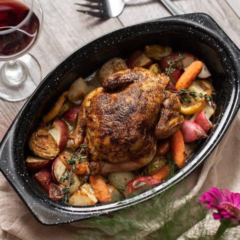 Oval 13 Inch Roaster With Lid Enameled Steel Pan That Holds Up To 7 Lb Poultry Or Roast Heat Resistant To 932 Degrees Fahrenheit Ideal For Two Even Cooking No Fuss Dinners with roasted chicken and vegetables