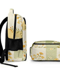 Side and top view of Yellow Green Plaid Floral Print Backpack for Everyday Use, showing floral design and multiple pockets.