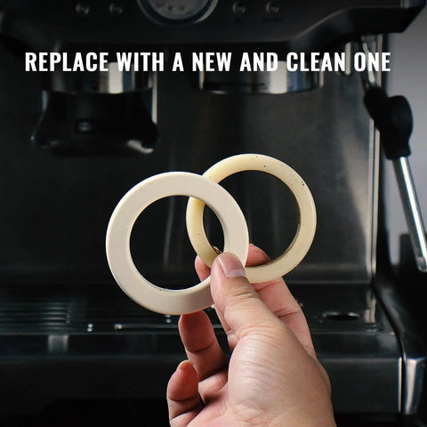58mm Silicone Steam Ring Set Of 2 for Breville and Sage Espresso Machines gasket held in hand with coffee machine in background