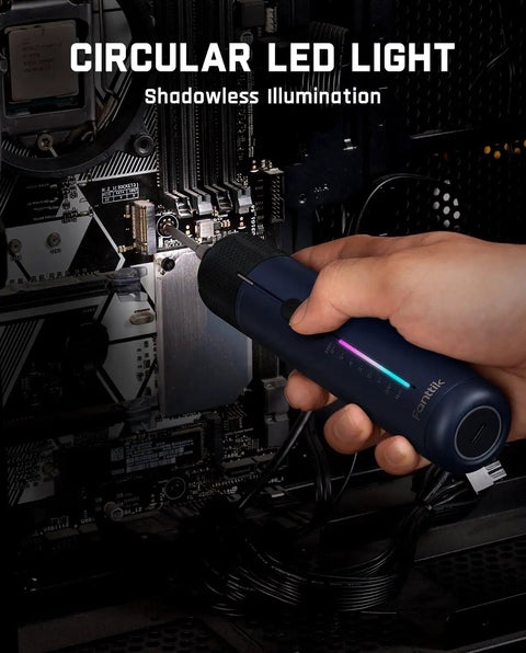 Hand holding a circular LED light illuminating a computer motherboard, shadowless illumination for precision work.
