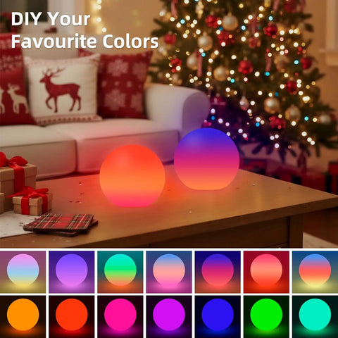 Two LED night lights with 16 RGBW colors on table, Christmas decor; related to 4 Inch Cordless LED Cube Night Light With 16 RGBW Colors And Remote Control Rechargeable Battery Mood Lamp For Kids Ambient Lighting IP44 Waterproof Milky White Polyethylene.