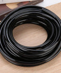 10M Garden Drip Irrigation Hose Kit, PVC Flexible Tubing 8 To 11 mm, coiled black hose on a wooden surface, smooth inner wall
