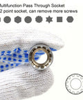 Gloved hand holding a chrome vanadium steel pass-through socket from the 29 Piece One Quarter Inch Drive Ratchet Wrench Kit.