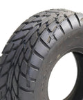 Close-up of ATV All Terrain Tires Set Of 2 16x8-7 200/55-7 4PR Tubeless showing deep tread pattern for mud, rocks, and rough terrain performance.