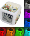 Fresh Spring Flower Printed Cube Digital Desk Clock Running Completely Silent With Sleek Date And Temp Screen Soft Glow Nightlight Mode And Auto Snooze For Chillin On Your Bedside Table Or Home Office Desk Setup.