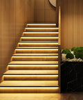 Staircase lit by U Shape LED Channel For LED Strip Lights 3.3ft 1Meter Thick Milky Diffuser With 60 Degree Curve Anti Light Leakage