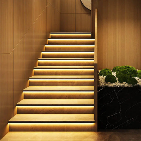 Staircase lit by U Shape LED Channel For LED Strip Lights 3.3ft 1Meter Thick Milky Diffuser With 60 Degree Curve Anti Light Leakage