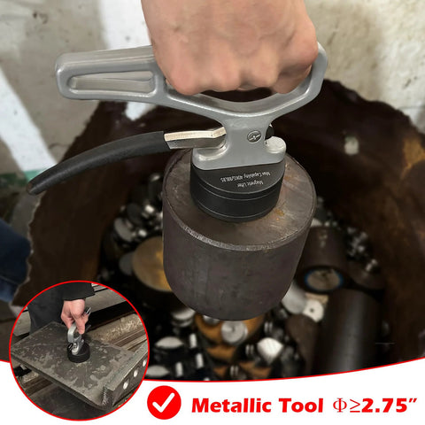 MUTUACTOR magnetic pickup tool with release handle, grey grip, lifting a heavy iron cylinder