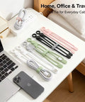 Heavy Duty Reusable Silicone Cable Ties Sort Your Wire Mess Like A Boss Handle Data Cables Zero Sweat Always Keep Your Workspace Crisp With This Flexible Tear Proof 20 Pack Organizer Kit on a desk with various cords.