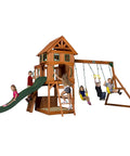 Kids playing on Atlantis Cedar Wood Swing Set With Wave Slide And Raised Clubhouse Featuring Rock Wall, Belt Swings, Trapeze