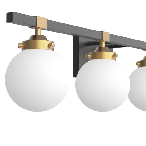 Close-up of Four Light Mid Century Modern Bathroom Vanity Light Fixtures Over Mirror In Black And Gold With Milk White Glass Globes Wall Mount