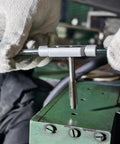 Using All In One 100 Piece Drill And Tap Set With SAE And Metric Sizes For External And Internal Threading on metal surface.
