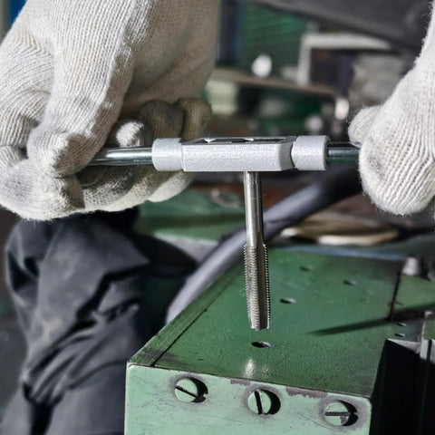 Using All In One 100 Piece Drill And Tap Set With SAE And Metric Sizes For External And Internal Threading on metal surface.
