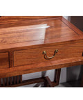 Six Pack Traditional Bail Cabinet Pulls In Antique Brass For Dresser Drawers And Cabinets, shown on a wooden desk drawer.