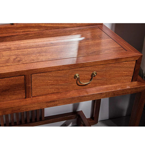 Six Pack Traditional Bail Cabinet Pulls In Antique Brass For Dresser Drawers And Cabinets, shown on a wooden desk drawer.