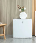 Hella Quiet 1.1 Cu Ft Countertop Upright Mini Freezer In Snazzy Steel White with removable shelves in stylish setting.