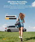 Person carrying 200W Peak Portable Bluetooth Speaker with Deep Bass, IP65 Waterproof, showcasing strap in outdoor setting